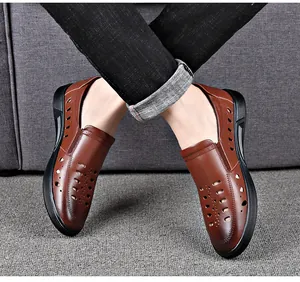 Detail view of men's brown leather hollow sandals with breathable laser-cut holes.