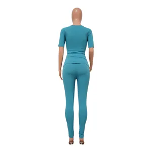 Back view of teal rib-knit plus size sports set showing slim fit and fine texture