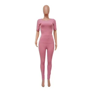 Pink ribbed two-piece high-elastic athletic set with short sleeve top and leggings