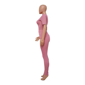 Side view of pink ribbed high-elastic sports two-piece set showing fabric texture