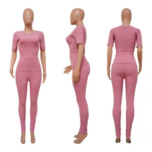 Front side and back views of pink two-piece ribbed high elastic sports set for women