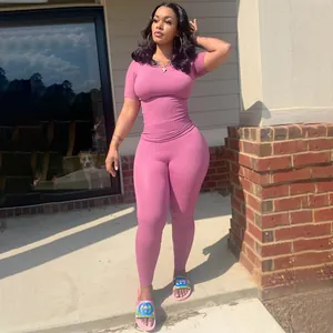 Pink ribbed two-piece workout lounge set with short sleeve top and high waist leggings