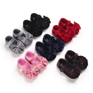 Selection of velvet baby girl Mary Jane shoes with bow decoration in various colors