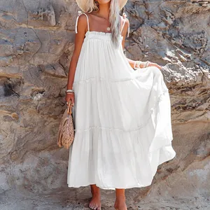 Elegant white tiered spaghetti strap maxi dress perfect for summer beach vacations
