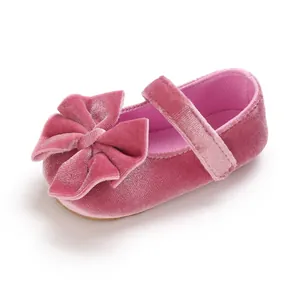 Detailed view of soft pink velvet baby girl princess walker shoe featuring a large bow