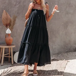Elegant black tiered strappy maxi dress with ruffles for summer beach vacation lifestyle