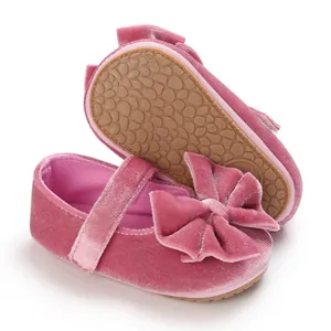 Detail of pink velvet baby girl Mary Janes with soft non-slip pebble sole