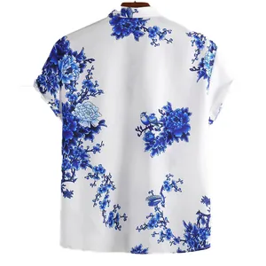 Back view of a men's white short-sleeve shirt with blue ink floral and bird print