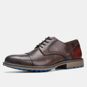 Side view of brown leather business casual shoe with burnished finish and cap toe