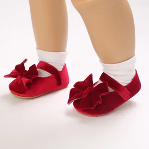 Elegant red velvet baby princess shoes with decorative bow for infant walking