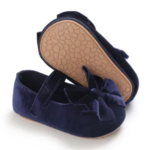 Elegant navy blue velvet baby girl princess shoes with large bow and non-slip sole texture