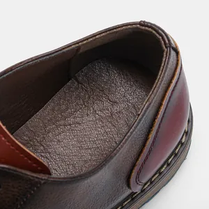 Close-up detail showing the leather lining and textured heel of a men's business shoe.