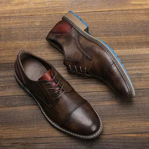 Premium brown burnished leather Derby shoes for men on a rustic wooden background texture