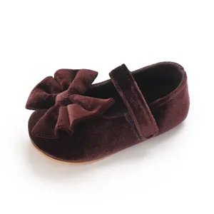 Elegant burgundy velvet baby girl Mary Jane shoes featuring a large decorative bow detail