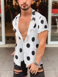 Detail view of a men's white short sleeve Hawaiian beach shirt with black polka dots