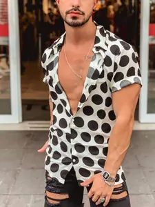 Detail view of men's sexy slim fit Hawaiian beach shirt with black polka dots