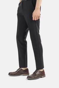 Detailed side view of men's brown burnished leather dress shoes with blue sole accent