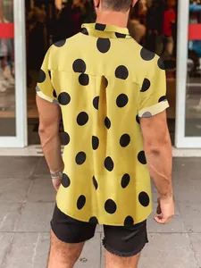 Back detail of a men's yellow Hawaiian beach shirt featuring bold black polka dot pattern