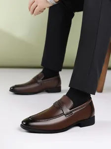 Detailed side view of brown men's leather loafers with a gradient burnished toe effect