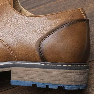 Detailed close-up of brown business leather shoes showing fine stitching and leather texture