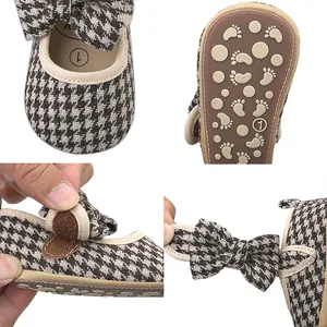 Detailed views of houndstooth baby walker shoes with bow and anti-slip rubber sole