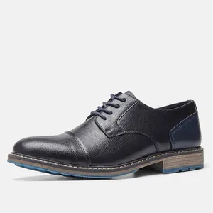 Side view of black business casual leather shoe with blue stitch detailing