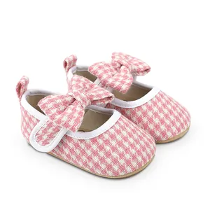 Pink houndstooth baby girl walking shoes with cute bow detail for infants 0-1 year old