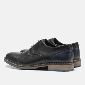 Side view detail of men's business casual leather shoes with blue burnished heel
