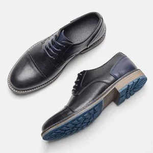 Detailed view of men's business casual black leather shoes with blue heel accents.