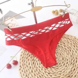 Detailed close-up of red sporty women's panties featuring a hollow-out lattice waistband.