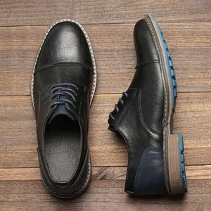 Top and side view of men's black leather business shoes with elegant blue accents