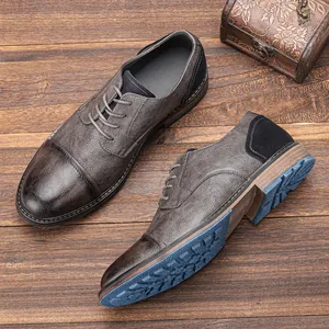 Detailed view of men's business leather shoes with durable blue textured outsole