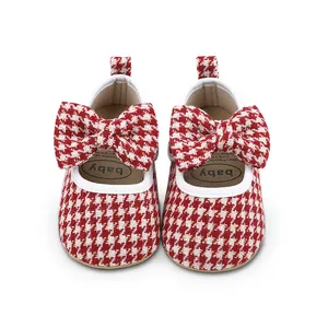 Front view of red and white houndstooth baby girl pre-walker shoes with bow