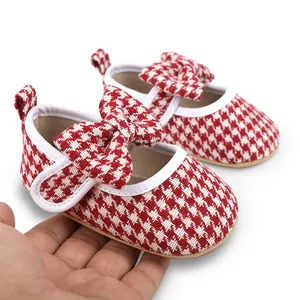 Red and white houndstooth pattern baby girl walking shoes with elegant bow detail