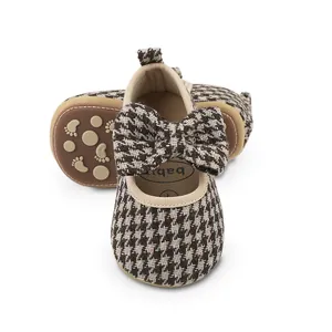 Detail of breathable houndstooth baby walking shoes with anti-slip rubber sole