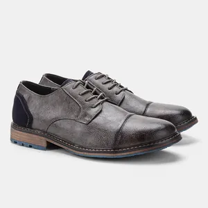 Close-up of men's business casual shoes with distressed leather and blue heel detail