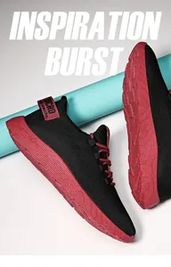 Vista laterale di scarpe sportive da uomo nere e rosse con suola spessa e traspiranti