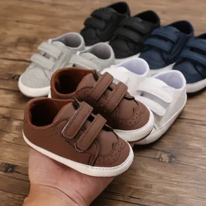 Soft-soled baby walker shoes for infants 0-1 year old with hook and loop closure.