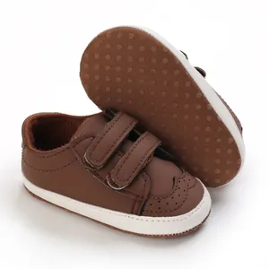 Detail of brown baby soft sole walker shoes featuring velcro straps and dot grip