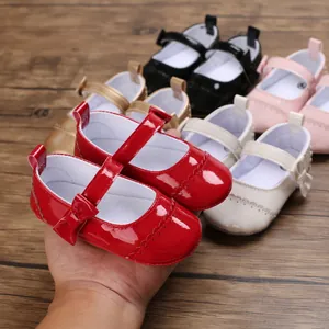 Detailed view of colorful patent leather baby Mary Jane shoes featuring cute bow accents