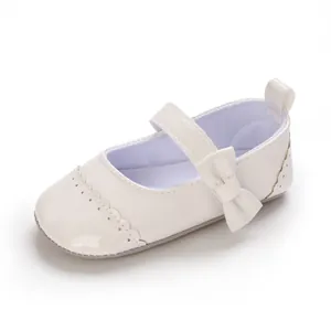 Detailed macro view of white baby girl princess walker shoe featuring a cute bow