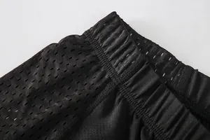Macro detail of breathable mesh fabric and elastic waistband on men's cycling shorts