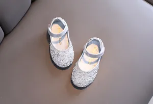 Detailed top view of shimmering silver rhinestone flats for girls' dance performances