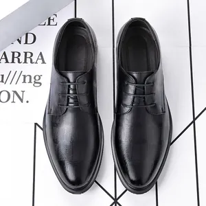 Black men's formal dress shoes with textured leather and pointed toe for business or wedding