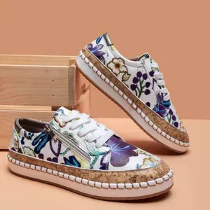 Stylish women's low-top casual sneakers with ethnic floral prints and cork platforms