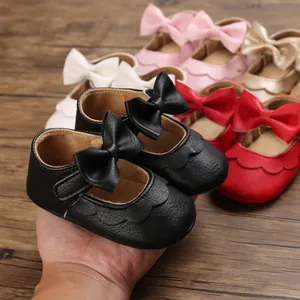 Detail view of premium soft-soled baby girl walking shoes with bows in multiple colors.