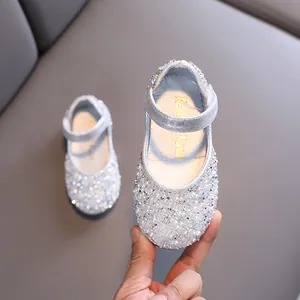 Silver girls' Mary Jane dress shoes with sparkling rhinestones and pearls.