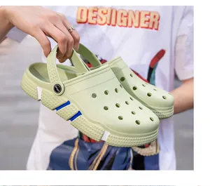 Macro view of light green summer clogs featuring breathable holes and blue accents