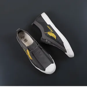Detail of breathable ice silk mesh men's sneakers with feather embroidery