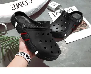 Close-up of black men's outdoor clogs with breathable holes and sporty accents
